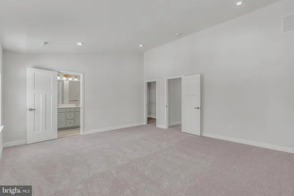 a bathroom with double sink and a mirror