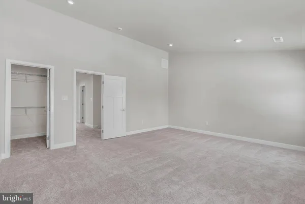 a bathroom with a shower sink vanity and mirror