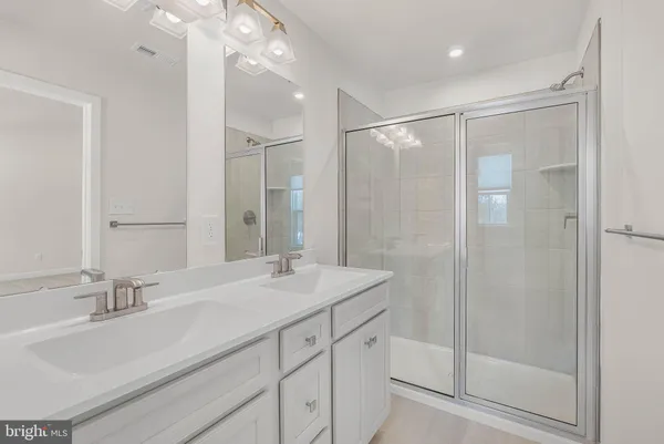 a view of a hallway with wooden shelves