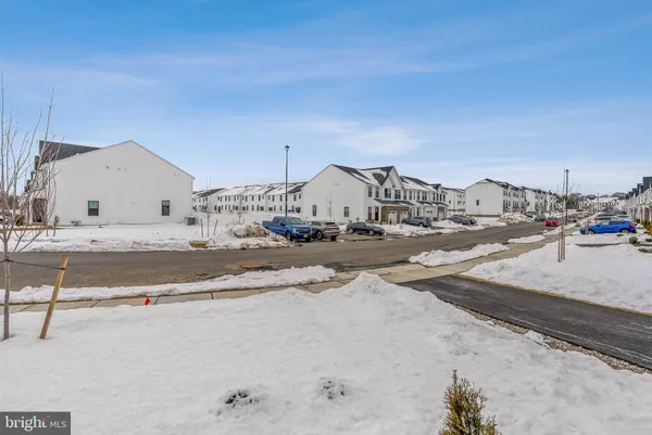 a view of a kitchen with wooden floor and a kitchen