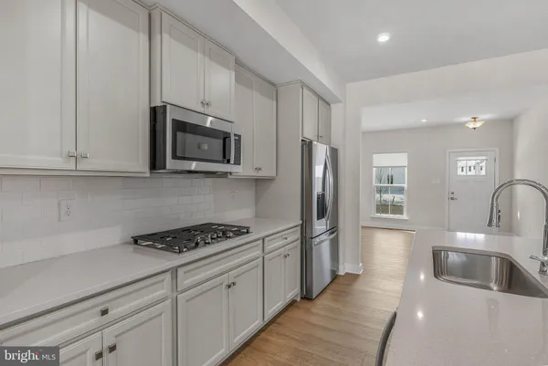 a kitchen with counter top space and sink