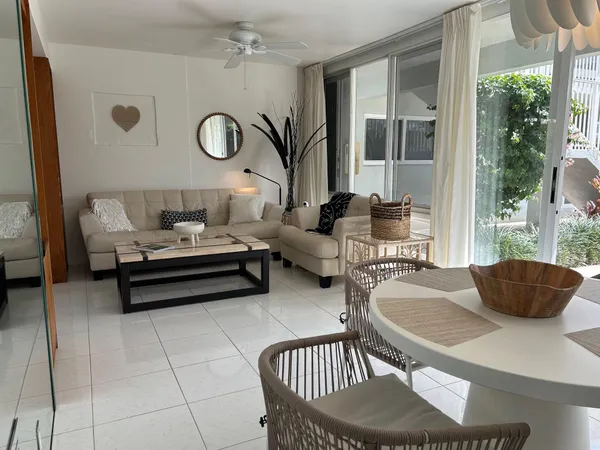 a living room with furniture and window