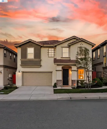 a front view of a house with a garage