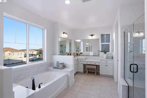 a large bathroom with a large tub and shower