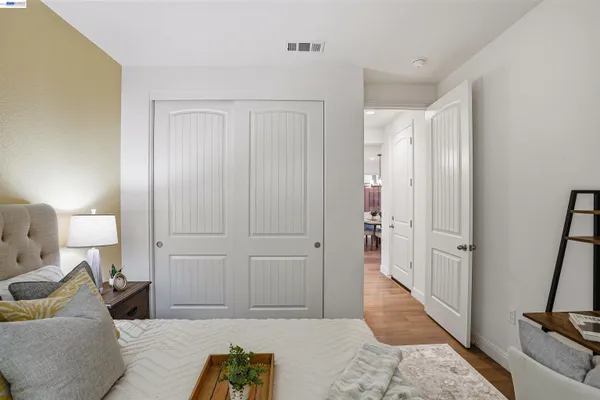 a bedroom with a bed and a couch