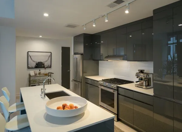 a kitchen with a table and chairs