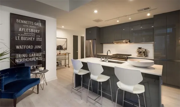 a large kitchen with a table and chairs