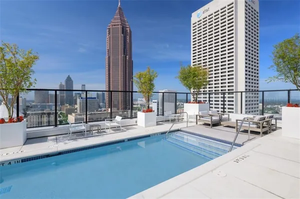 a view of a patio with couches and potted plants