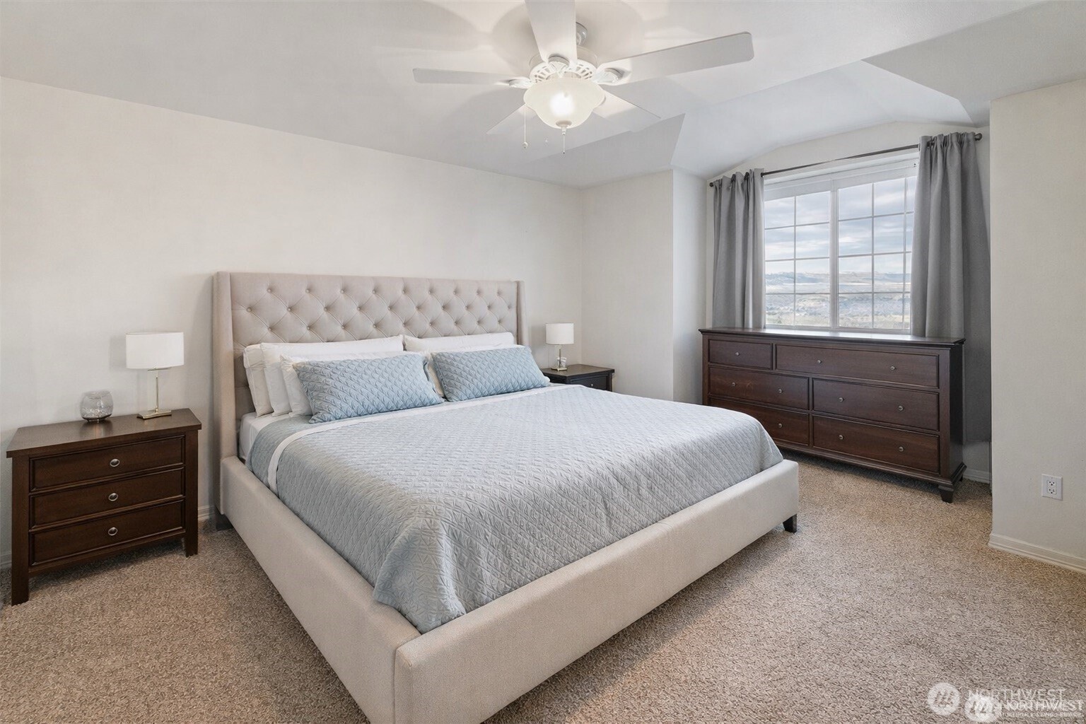 1918 Broadview Wenatchee, WA 98801 - Photo 25 of 38 a bedroom with a bed and a chandelier