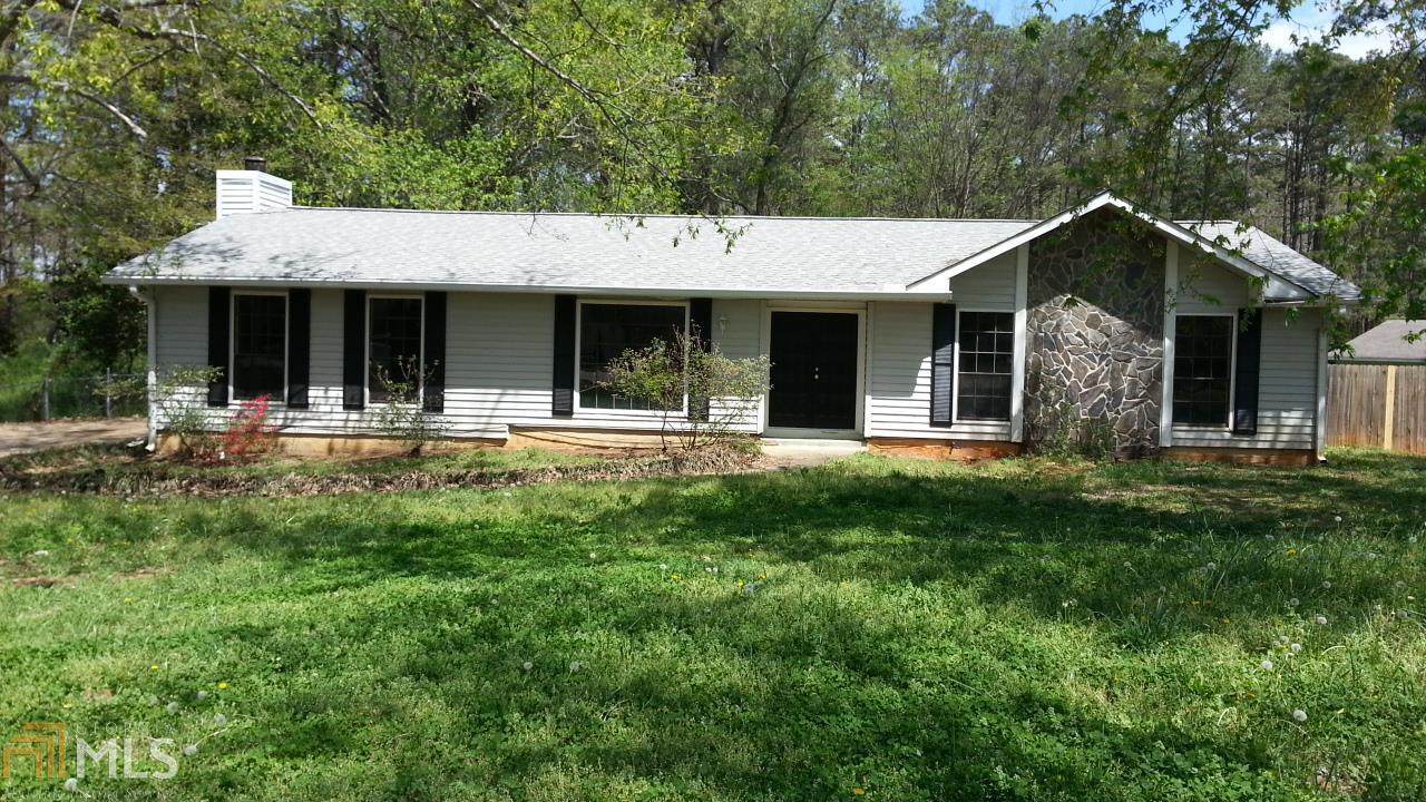 1268 Flat Rock Road Stockbridge, GA 30281 - Photo 1 of 1 a front view of house with yard and green space
