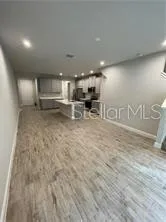 a view of a kitchen with a sink and cabinets