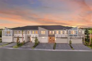 a front view of a house with a garden and patio