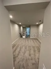 a view of a livingroom with car parked