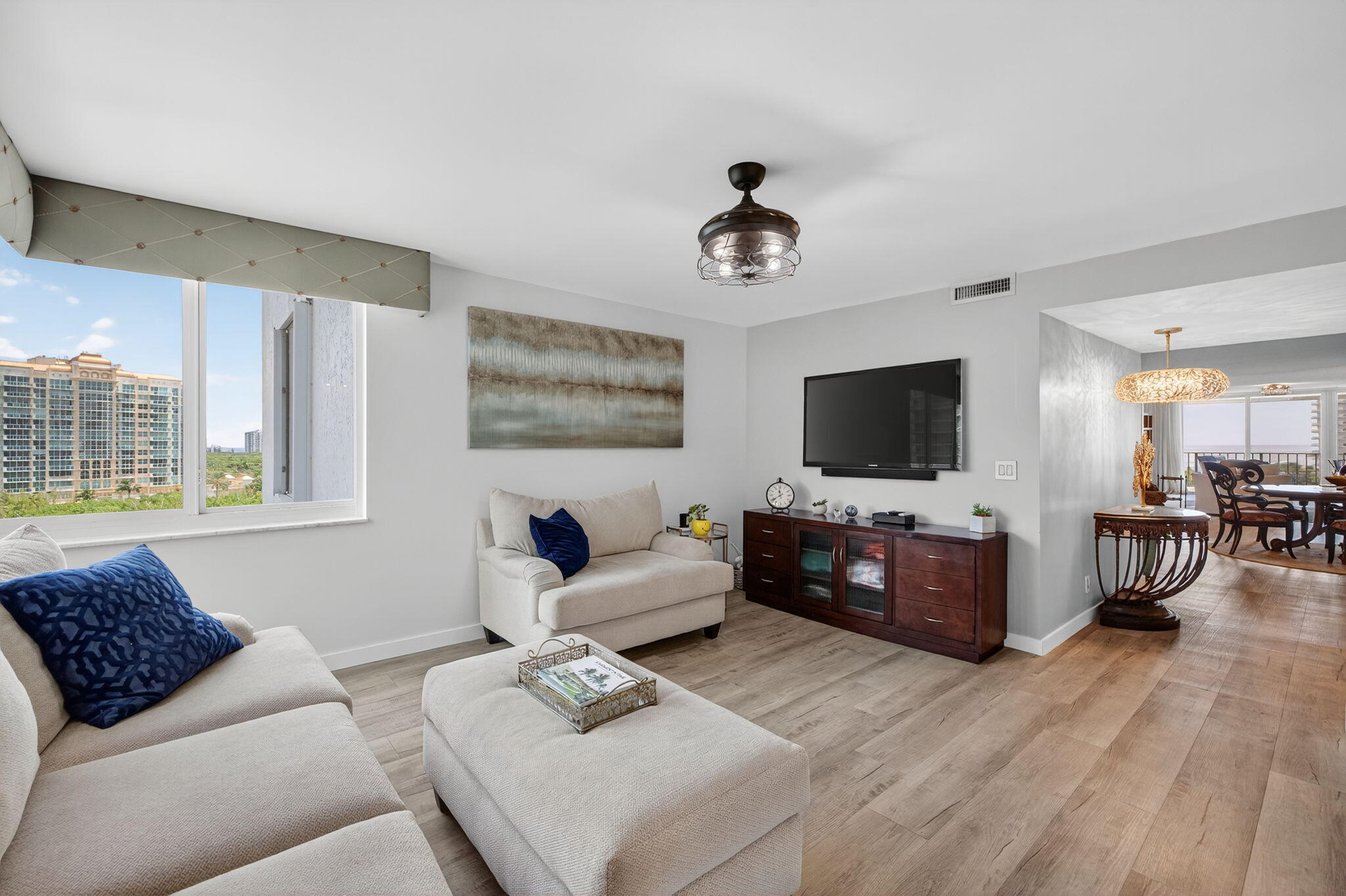 777 Bayshore Drive, Unit 1003 Fort Lauderdale, FL 33304 - Photo 15 of 49 a living room with furniture and a flat screen tv