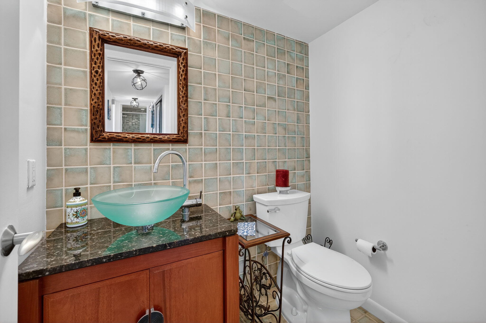 777 Bayshore Drive, Unit 1003 Fort Lauderdale, FL 33304 - Photo 27 of 49 a bathroom with a toilet a sink and mirror