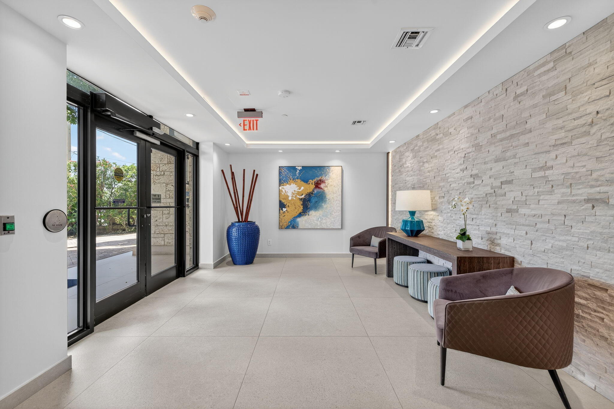 777 Bayshore Drive, Unit 1003 Fort Lauderdale, FL 33304 - Photo 4 of 49 a living room with furniture and a floor to ceiling window