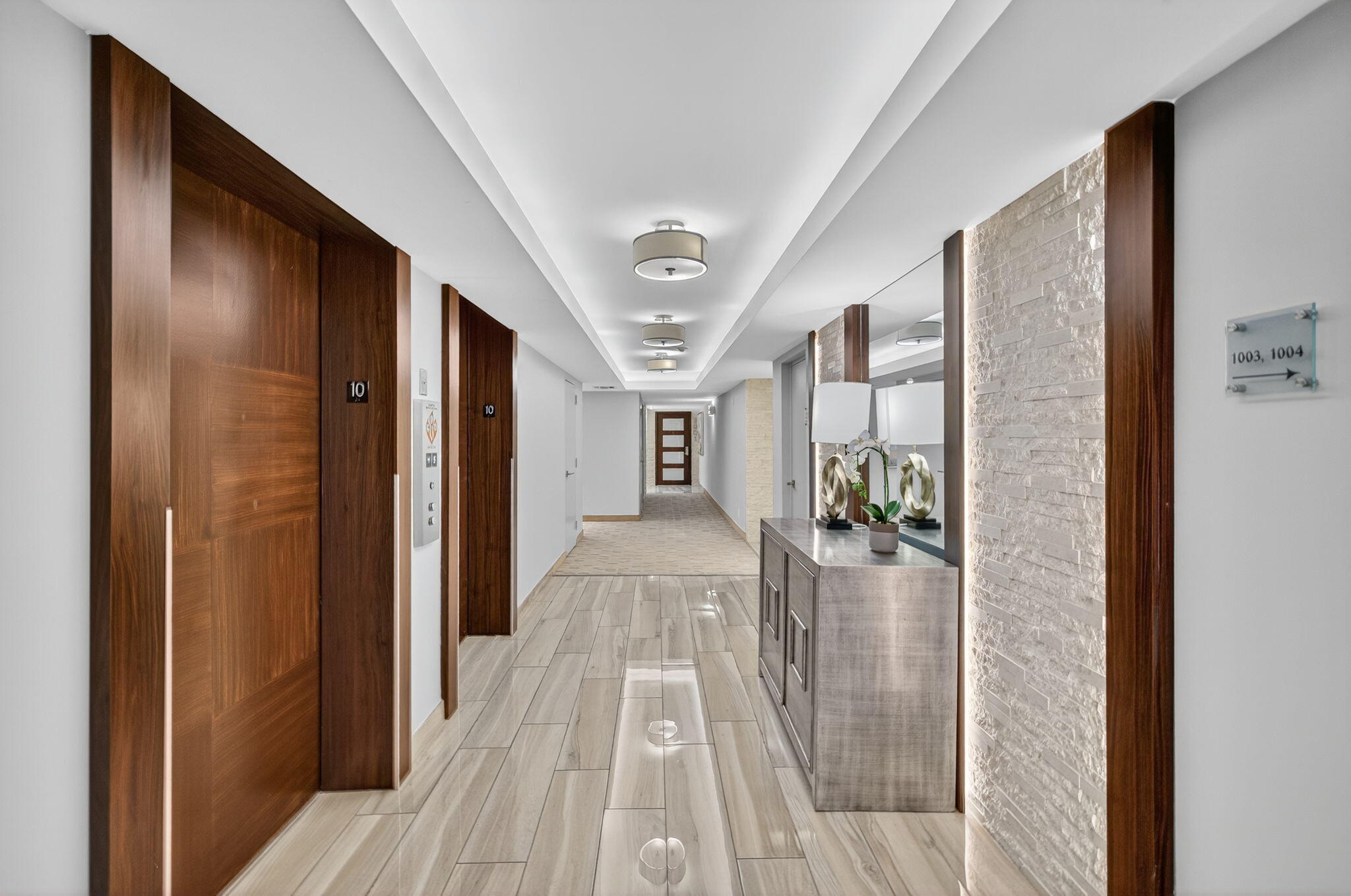 777 Bayshore Drive, Unit 1003 Fort Lauderdale, FL 33304 - Photo 6 of 49 a view of a hallway view with wooden floor and staircase
