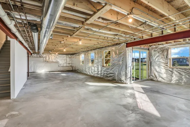 a view of an empty room with wooden walls