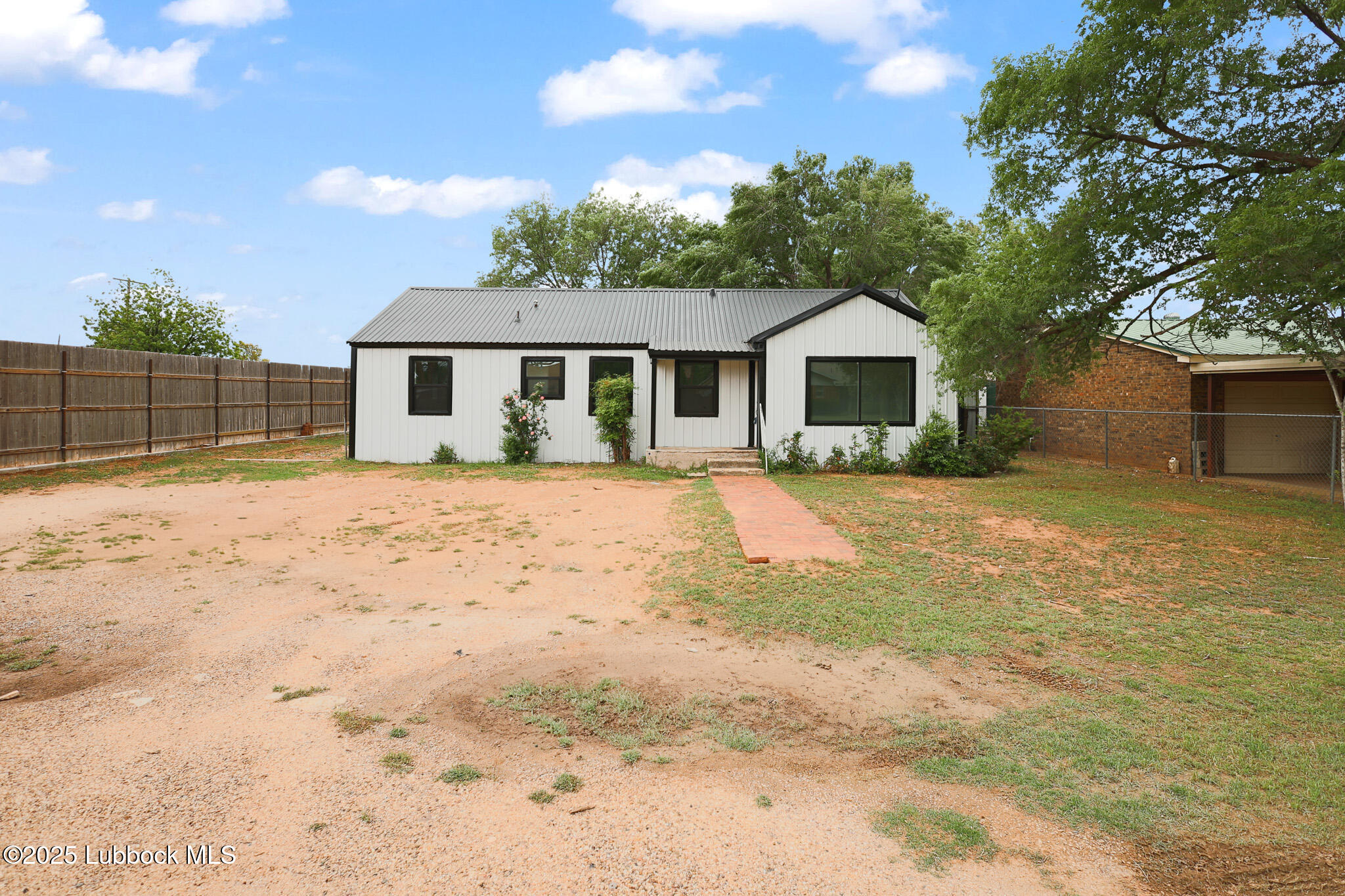 204 Chestnut Street Ropesville, TX 79358 - Photo 42 of 42 a front view of a house with a yard and garage