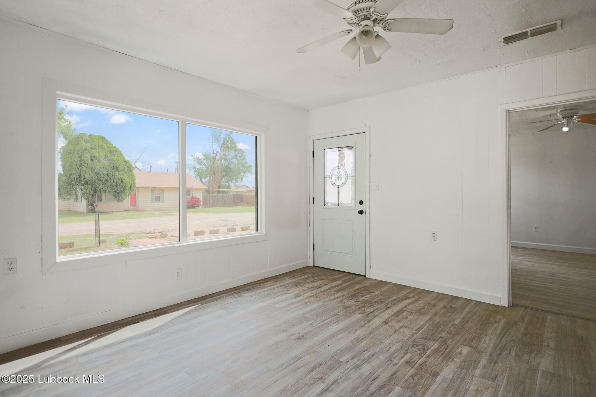 204 Chestnut Street Ropesville, TX 79358 - Photo 6 of 42 a view of an empty room with a window