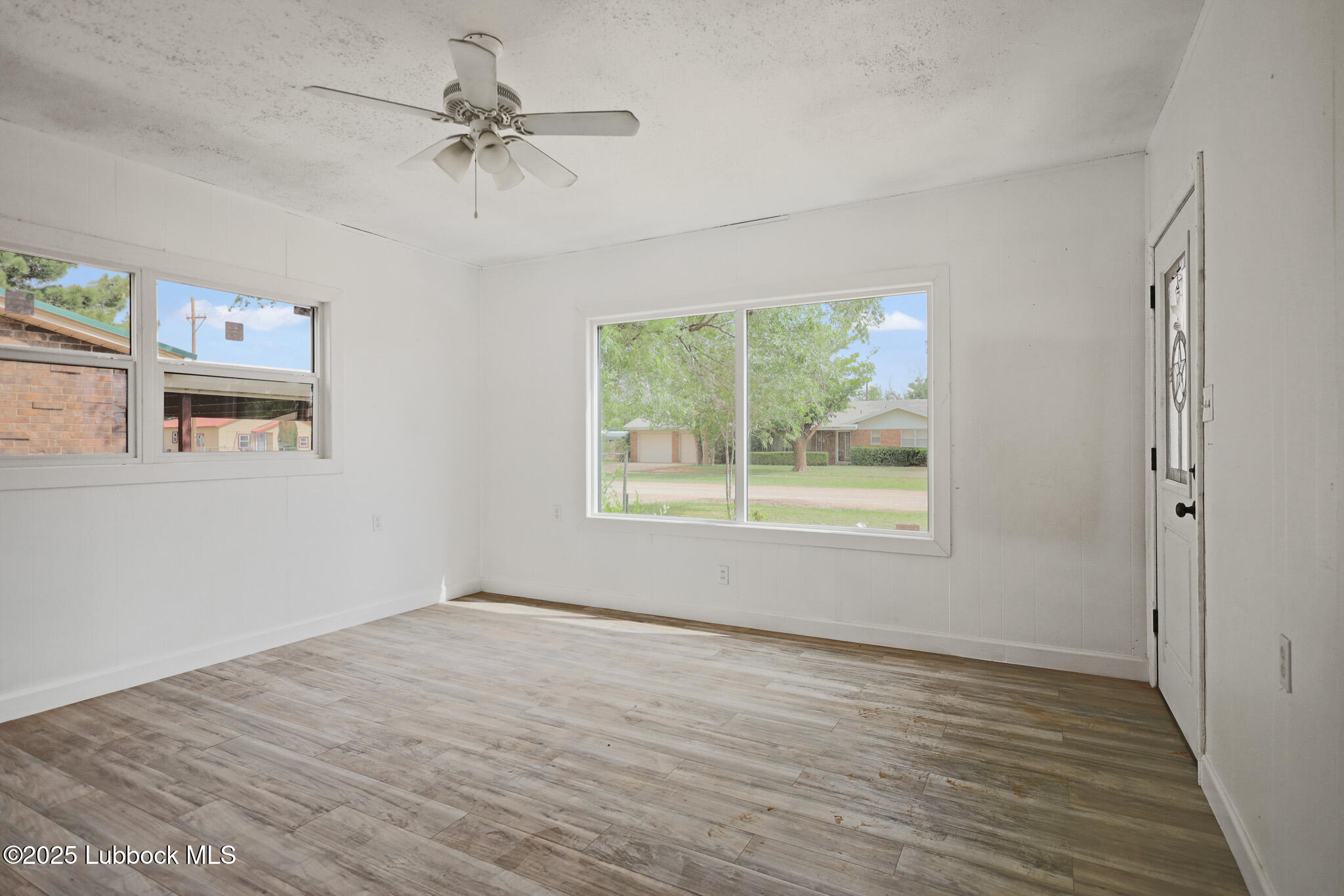 204 Chestnut Street Ropesville, TX 79358 - Photo 7 of 42 a view of an empty room with a window