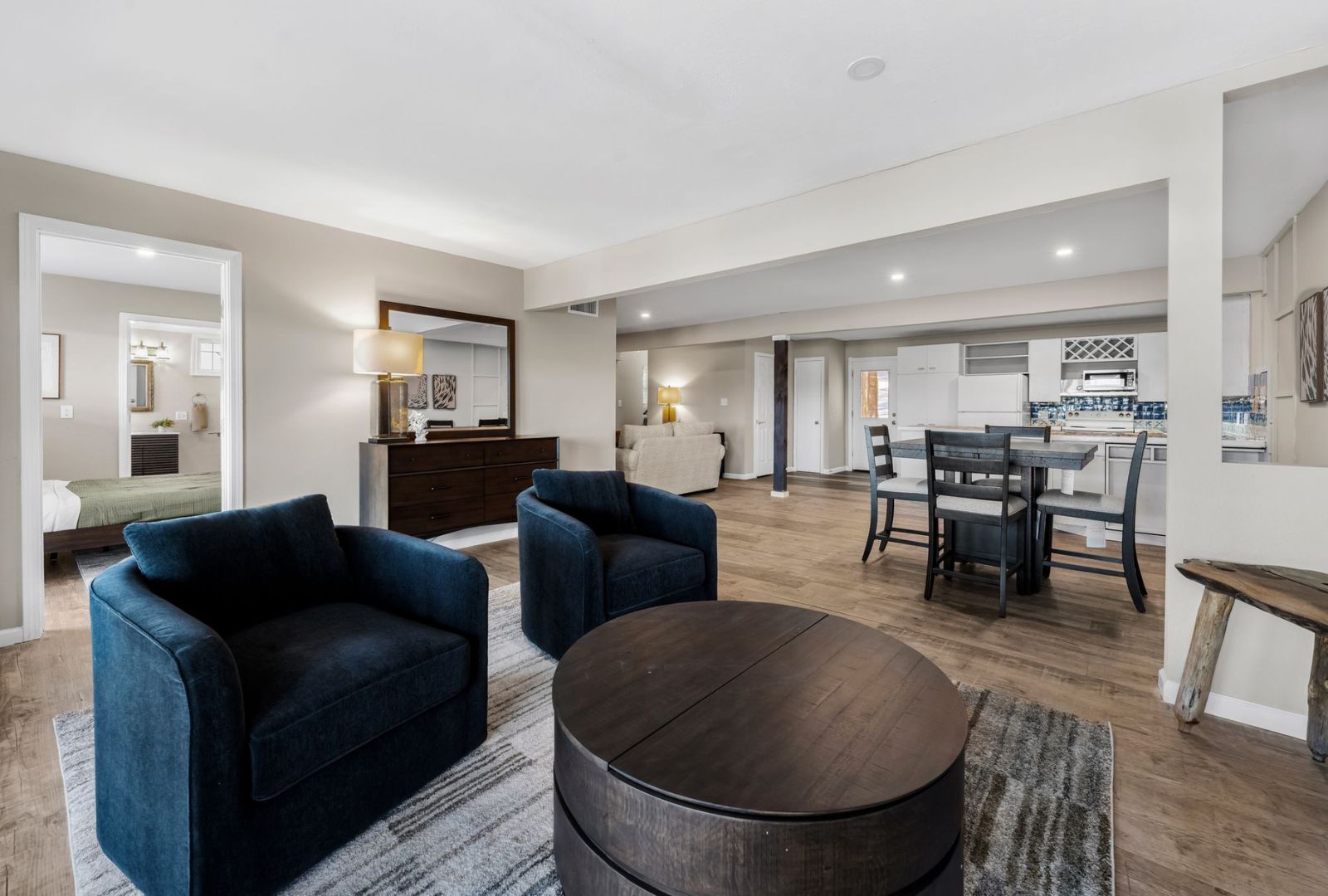 8124 Joy Road Volente, TX 78641 - Photo 11 of 31 a living room with furniture and a dining table with kitchen view