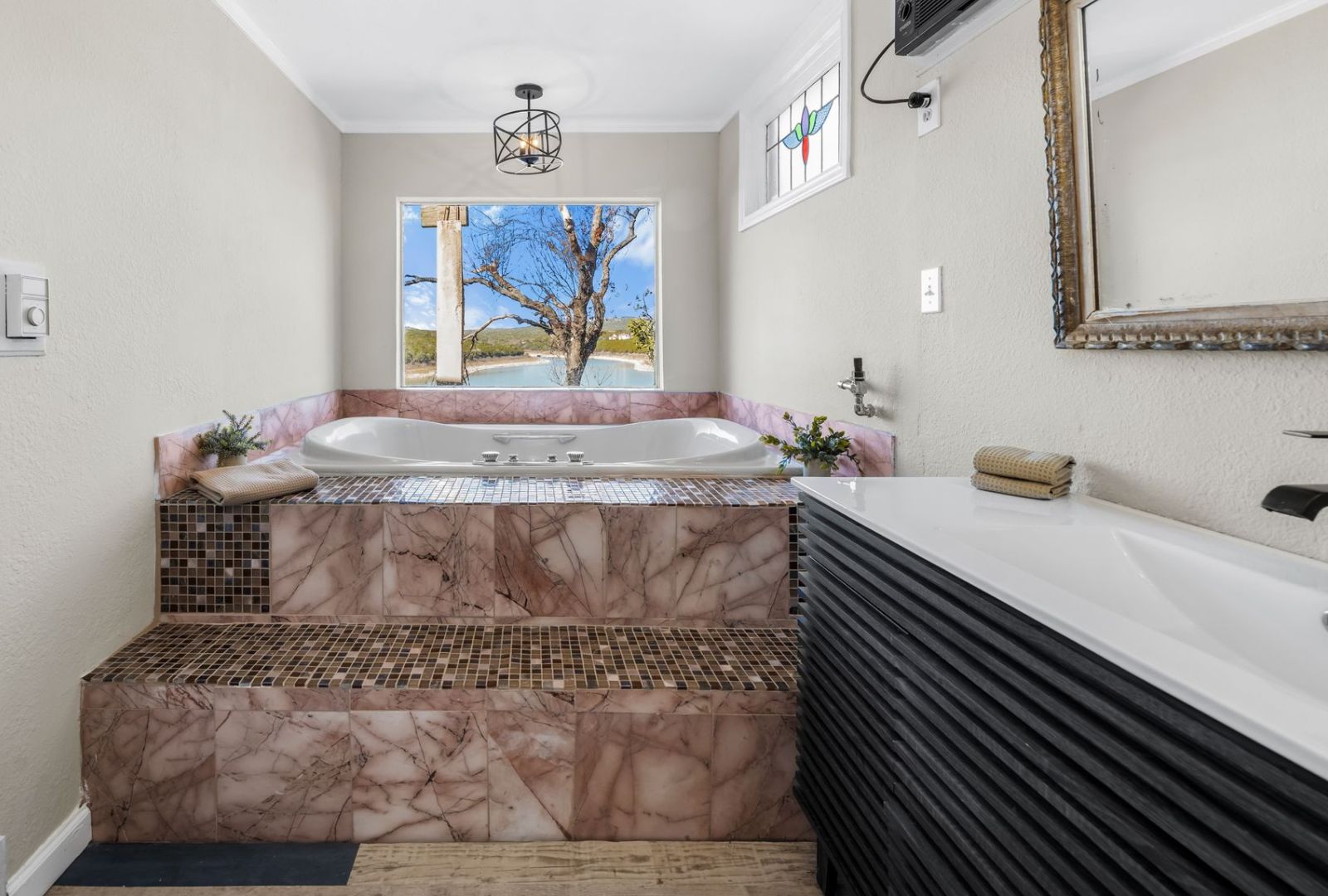 8124 Joy Road Volente, TX 78641 - Photo 14 of 31 a bathroom with a sink and mirror