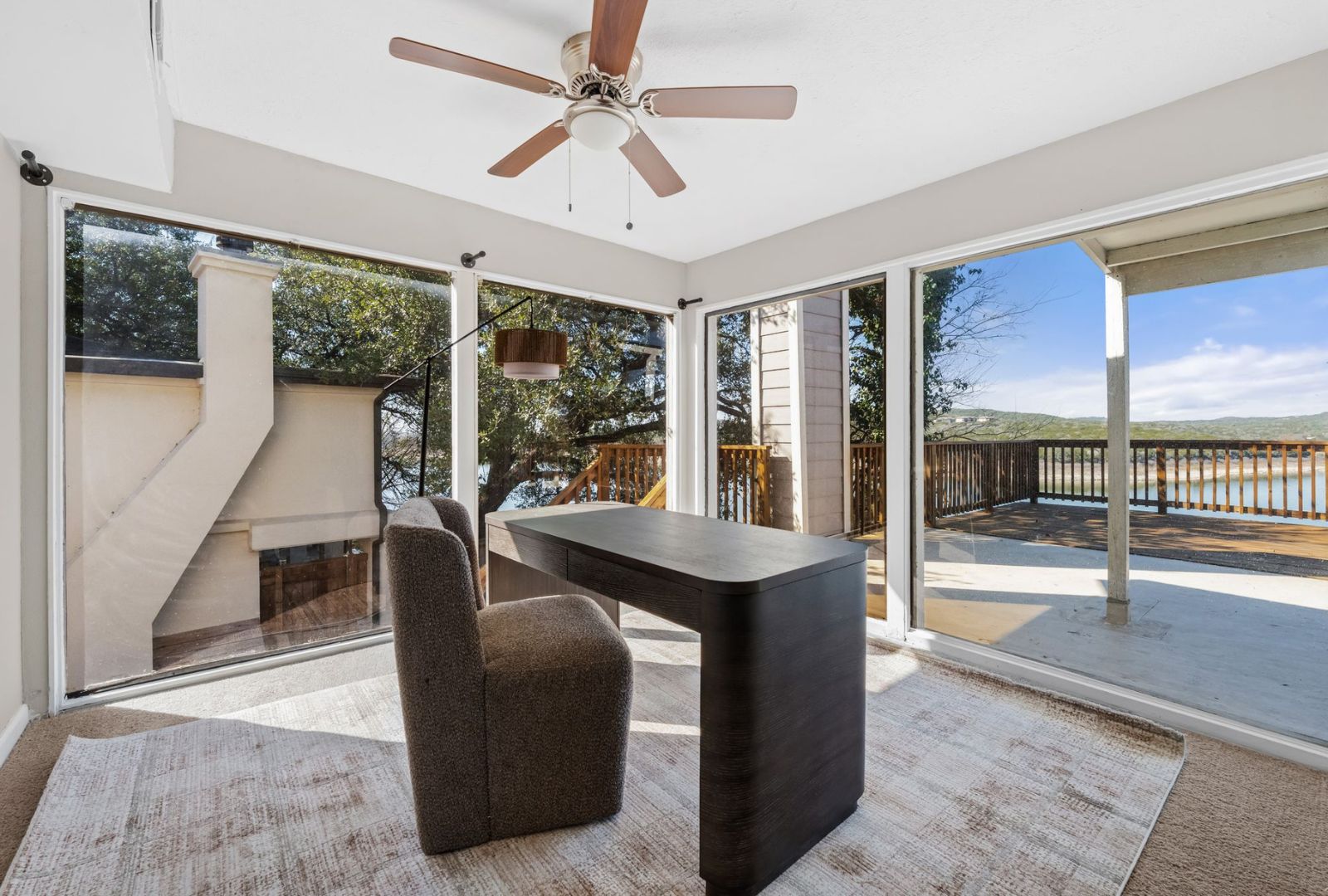 8124 Joy Road Volente, TX 78641 - Photo 16 of 31 a view of a dining room with furniture window and wooden floor