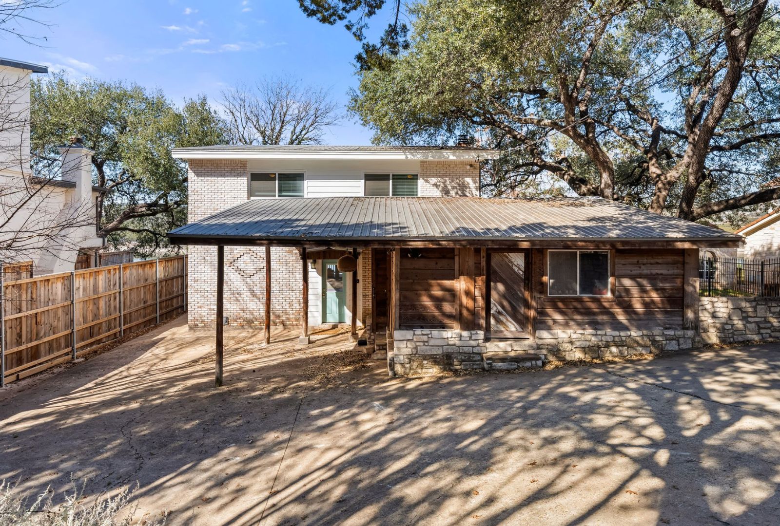 8124 Joy Road Volente, TX 78641 - Photo 21 of 31 a view of a house with large windows