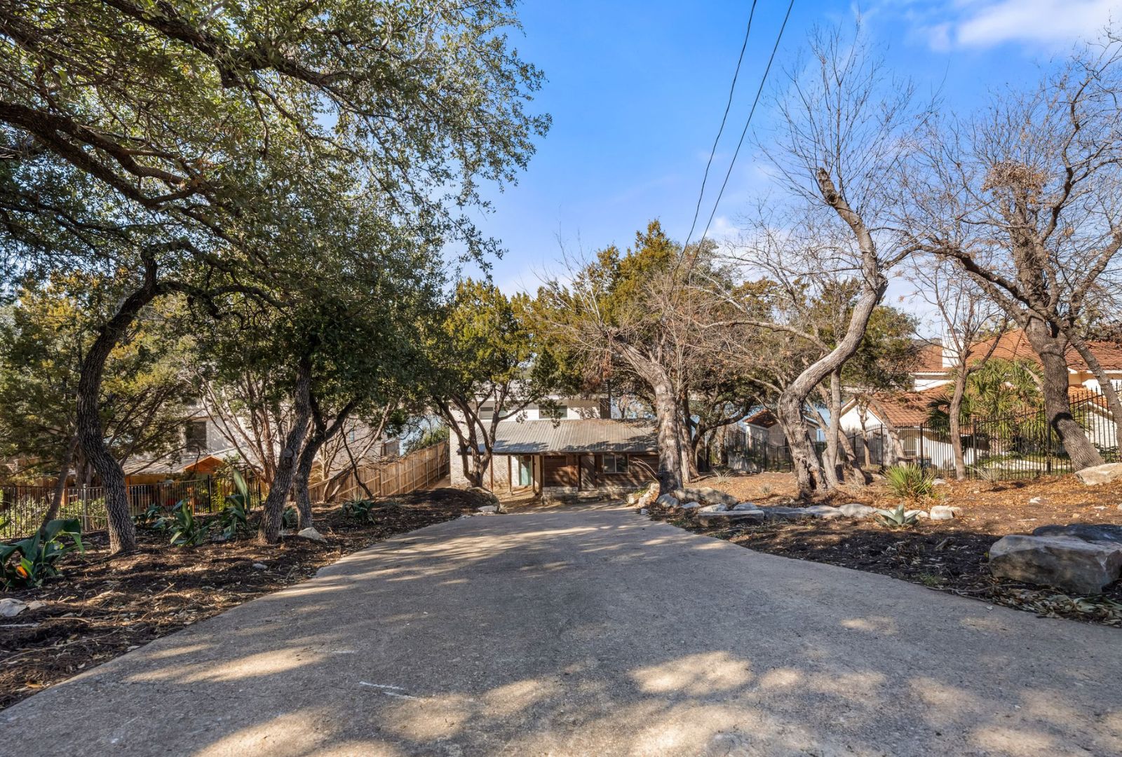 8124 Joy Road Volente, TX 78641 - Photo 22 of 31 a view of road with large trees