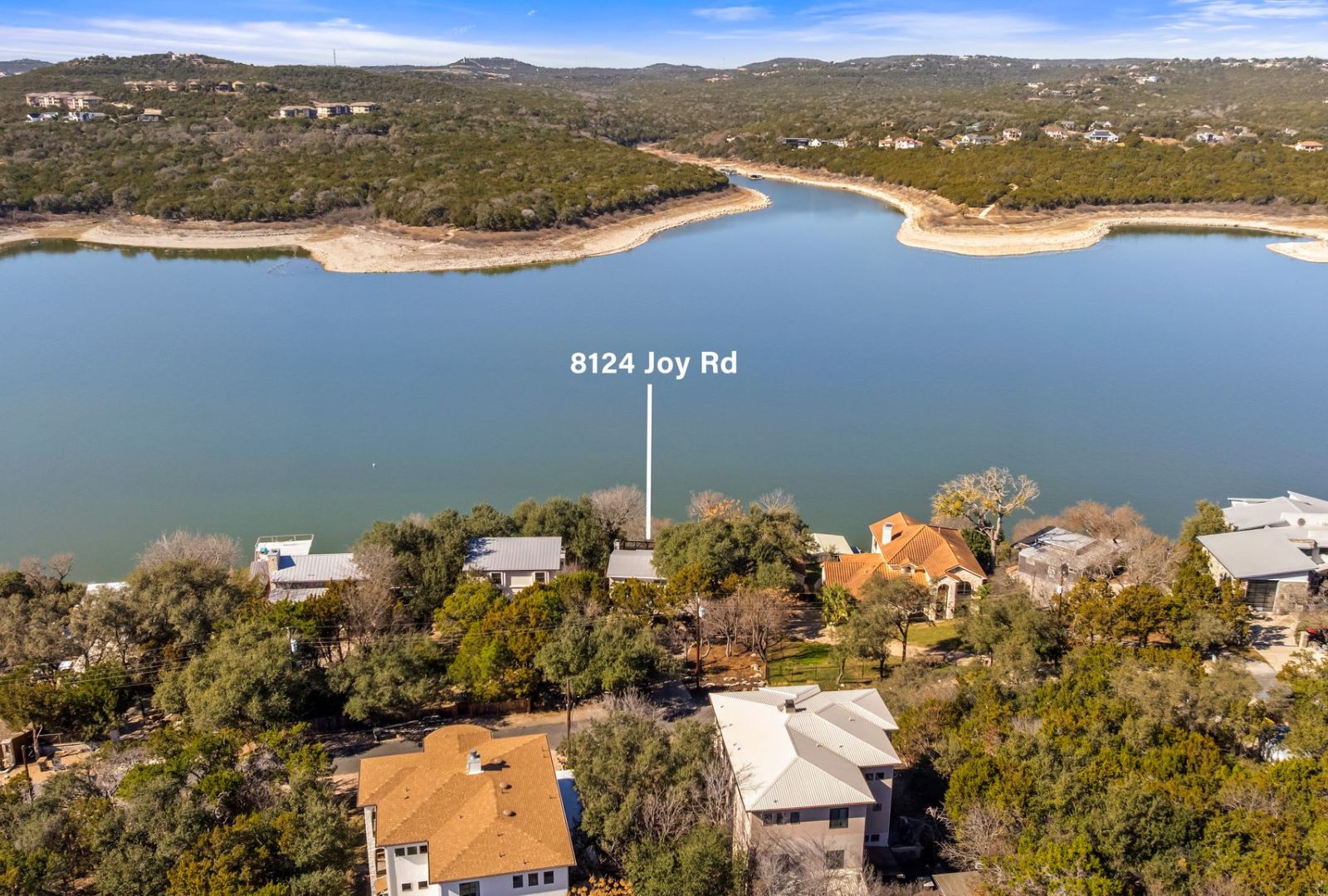 8124 Joy Road Volente, TX 78641 - Photo 28 of 31 a view of a lake with a mountain