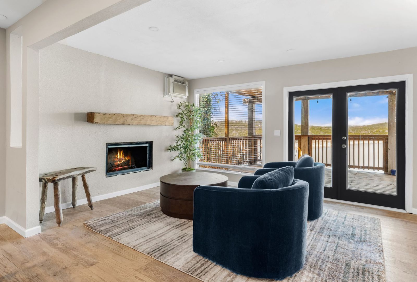 8124 Joy Road Volente, TX 78641 - Photo 9 of 31 a living room with furniture and a fireplace