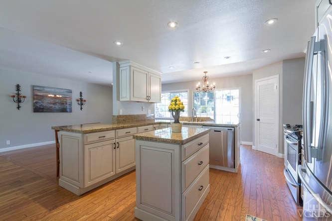 1321 Rambling Road Simi Valley, CA 93065 - Photo 14 of 42 a kitchen with granite countertop a sink cabinets and wooden floor