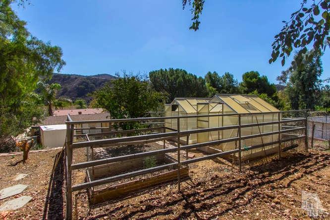 1321 Rambling Road Simi Valley, CA 93065 - Photo 40 of 42 a view of a yard with wooden fence