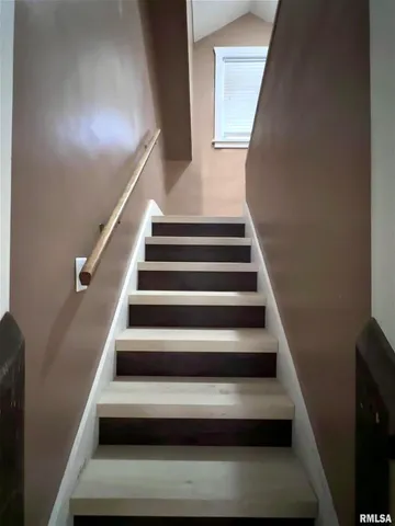 a view of a hallway with windows