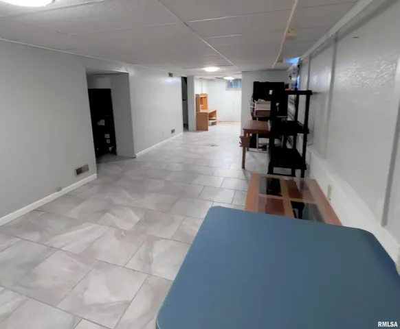 a storage room with lots of furniture and clutter