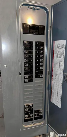 a view of a patio with couches under an umbrella
