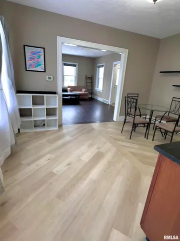 a view of a livingroom with furniture and a flat screen tv