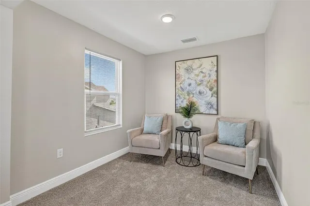 a living room with furniture and a window