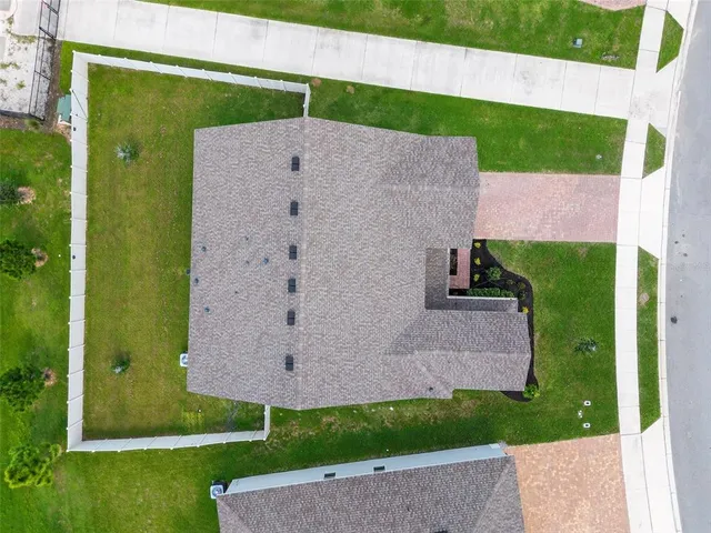 a aerial view of a house with garden
