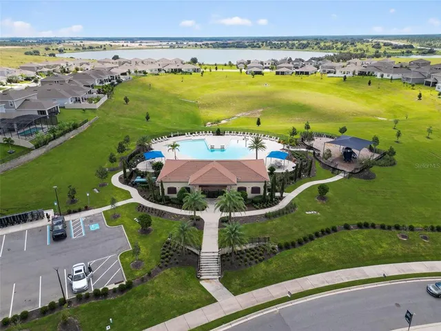 a living room with furniture a rug and a flat screen tv