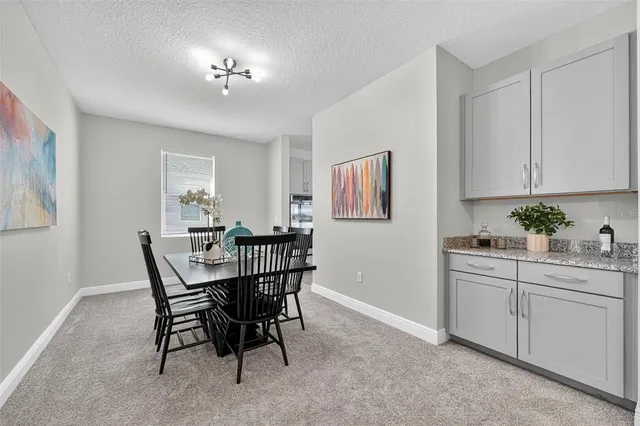 a view of a dining room with furniture