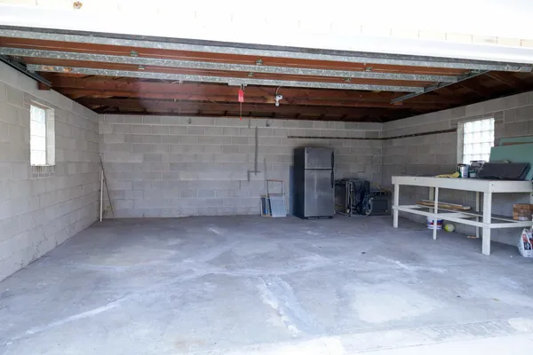 a view of a room with a chair and a fireplace