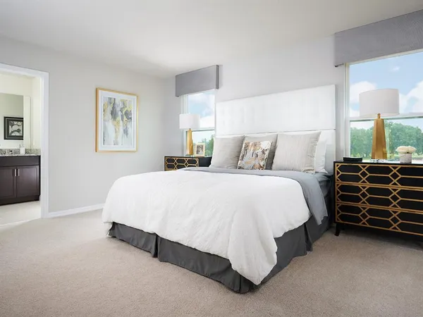 a bed room with a bed and dresser