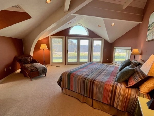 41 Naushon Road Aquinnah, MA 02535 - Photo 5 of 12 a bed sitting in a bedroom next to a window