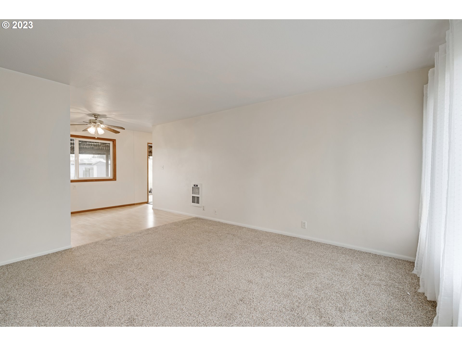 1403 L Street Springfield, OR 97477 - Photo 4 of 18 a view of an empty room and a window