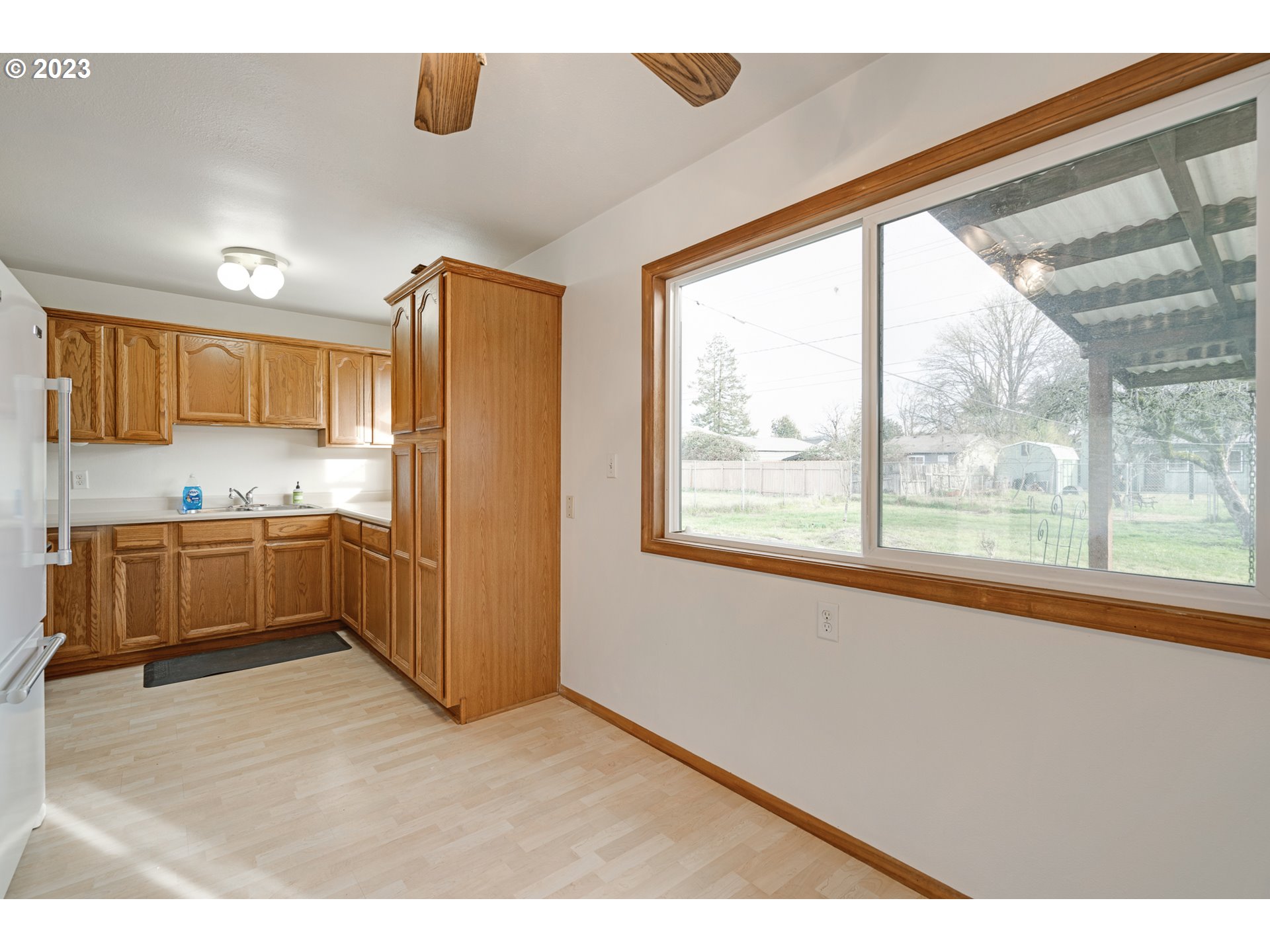 1403 L Street Springfield, OR 97477 - Photo 9 of 18 a kitchen with stainless steel appliances a refrigerator and a sink