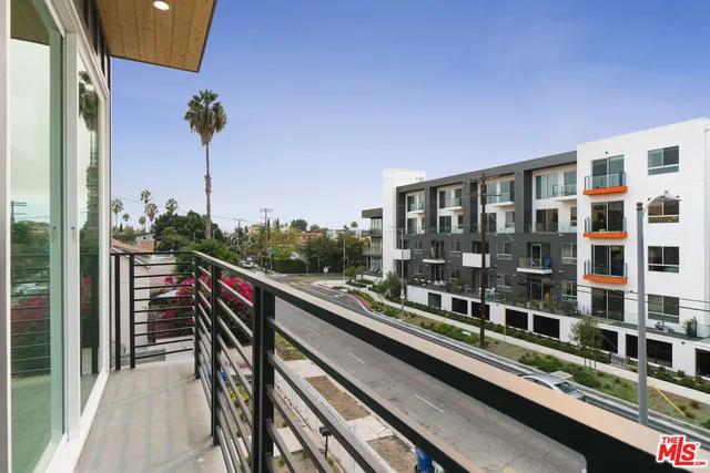 a view of a balcony with chairs