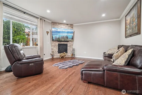 a living room with furniture fireplace and flat screen tv