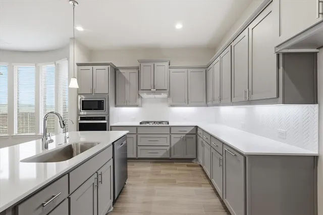 a view of a bathroom sink and a mirror
